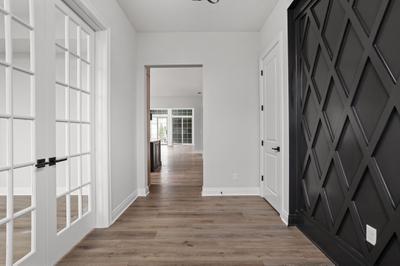 Entry Way Featuring Study with Glass Doors & Accent Wall Detail. New Home in Westfield, IN